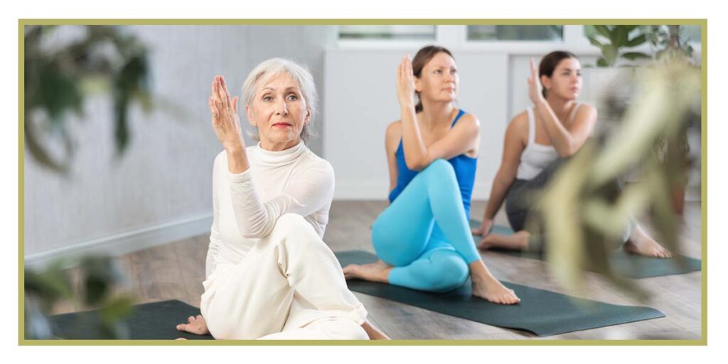 group of seniors exercising in a yoga class